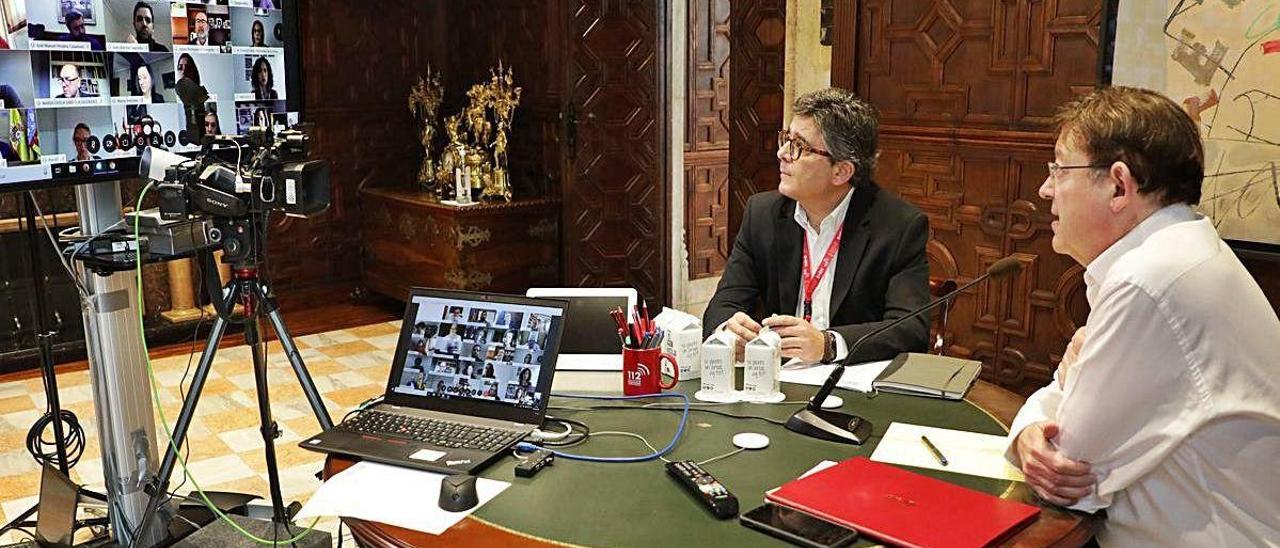 Ximo Puig junto a Alfred Boix, secretario autonómico de Promoción Institucional, ayer.