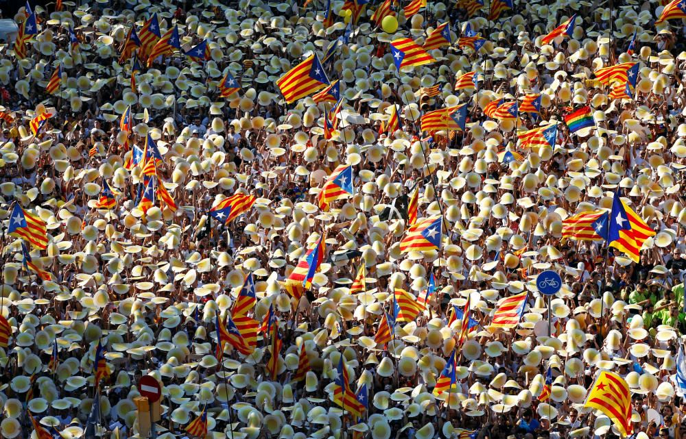 People hold Catalan separatist flags known as ...