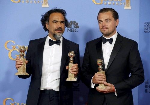 Alejandro Gonzalez Inarritu and Leonardo DiCaprio pose with their awards during the 73rd Golden Globe Awards in Beverly Hills