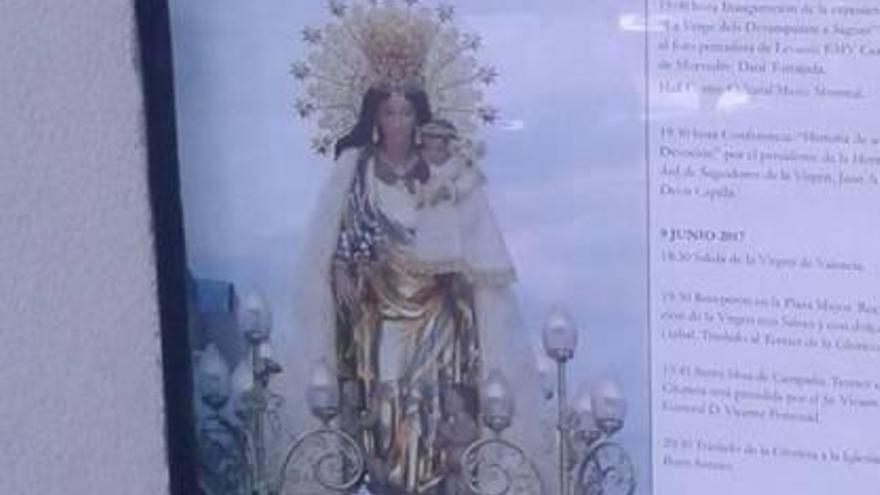 Un cartel sobre la visita a Sagunt de la Virgen.
