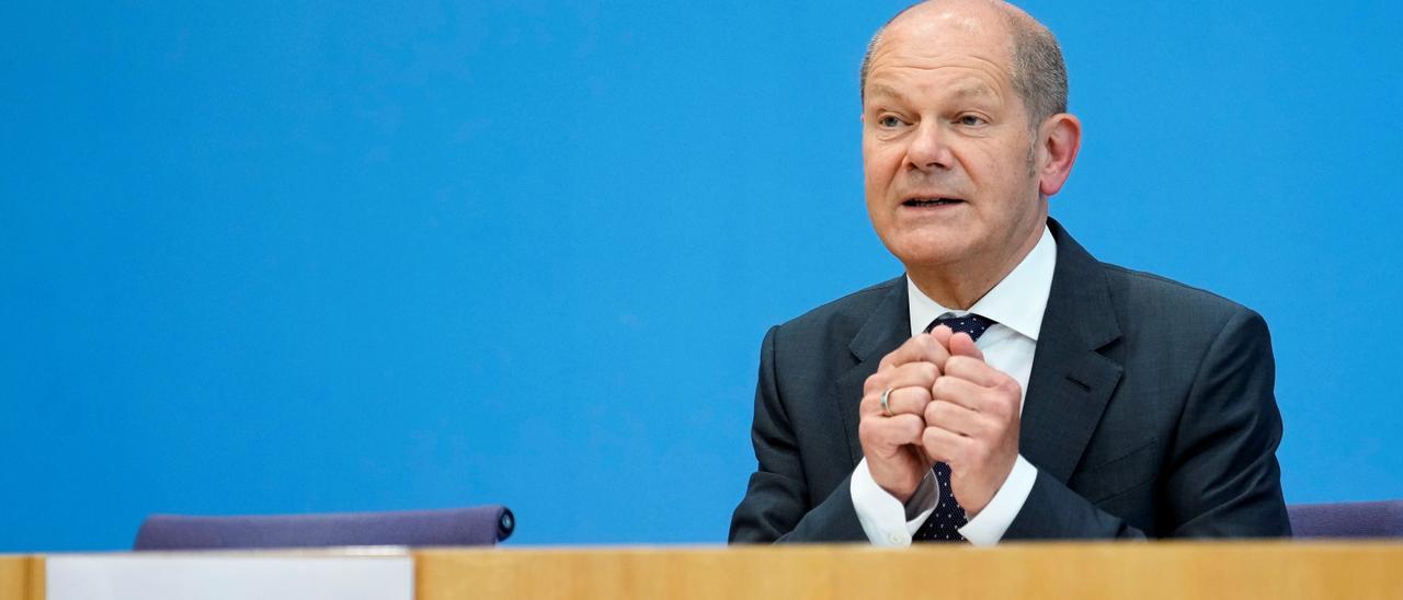 German Finance Minister Olaf Scholz briefs the media about the 2022 budget during a news conference in Berlin