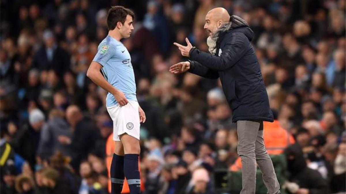 Guardiola y Eric, durante un partido