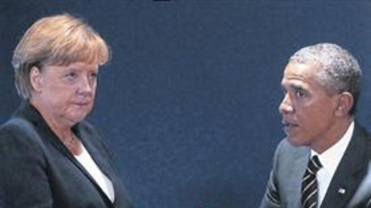 Angela Merkel y Barack Obama, dialogando en una cumbre reciente.