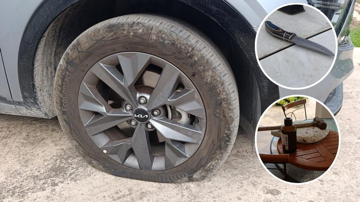 Una de las ruedas rajadas de los coches, junto a la navaja empleada y la maza con la que se golpeó a la puerta de la casa.