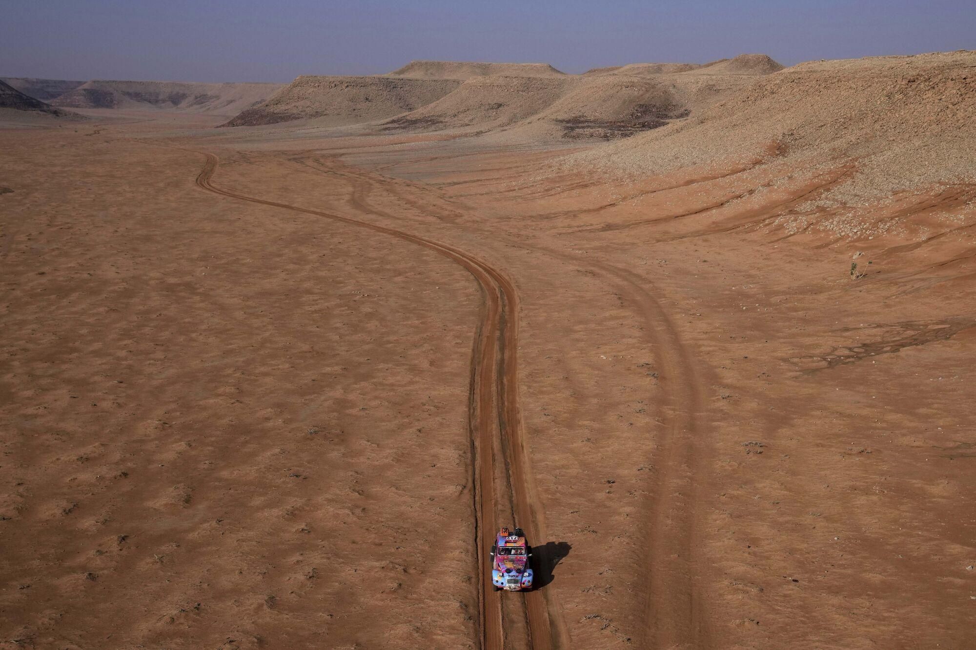 Driver Barbora Holicka and co-driver Lucie Engova drive their Citroen 2CV during the eighth stage of the Dakar Rally Classic between Al Duwadimi and Riyadh, Saudi Arabia, Monday, Jan. 13, 2025. (AP Photo/Christophe Ena) Associated Press/LaPresse. EDITORIAL USE ONLY/ONLY ITALY AND SPAIN