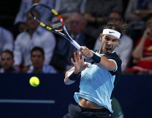 Nadal of Spain returns a ball to Switzerland's Federer during their match at the Swiss Indoors ATP men's tennis tournament in Basel