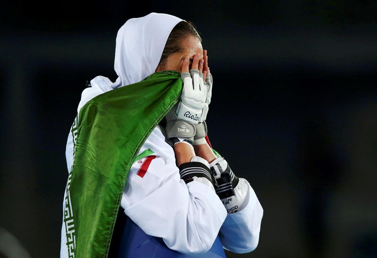 FILE PHOTO: 2016 Rio Olympics - Taekwondo - Women’s -57kg Bronze Medal Finals - Carioca Arena 3 - Rio de Janeiro, Brazil - 18/08/2016. Kimia Alizadeh Zenoorin (IRI) of Iran celebrates.  REUTERS/Peter Cziborra (BRAZIL  - Tags: SPORT OLYMPICS SPORT TAEKWONDO) FOR EDITORIAL USE ONLY. NOT FOR SALE FOR MARKETING OR ADVERTISING CAMPAIGNS/File Photo