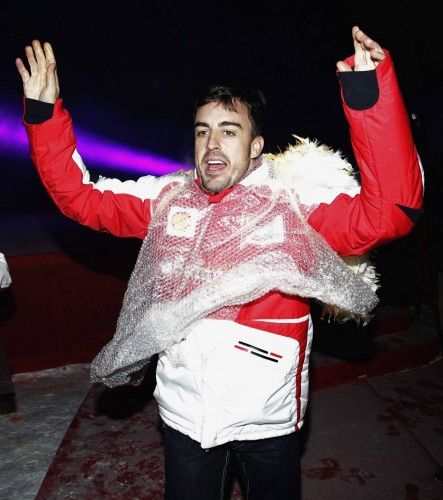 Ferrari Formula One driver Alonso gestures after performing on stage during the Wrooom, F1 and MotoGP Press Ski Meeting, in Madonna di Campiglio
