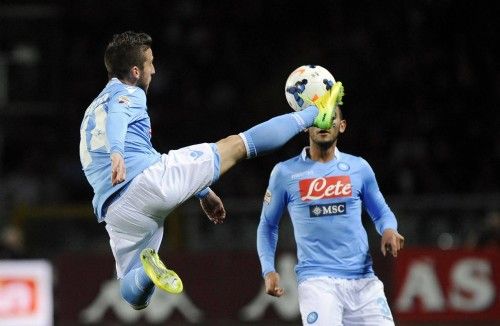 Napoli's Mertens controls an aerial ball next to Ghoulam during their Italian Serie A soccer match against Torino FC in Turin