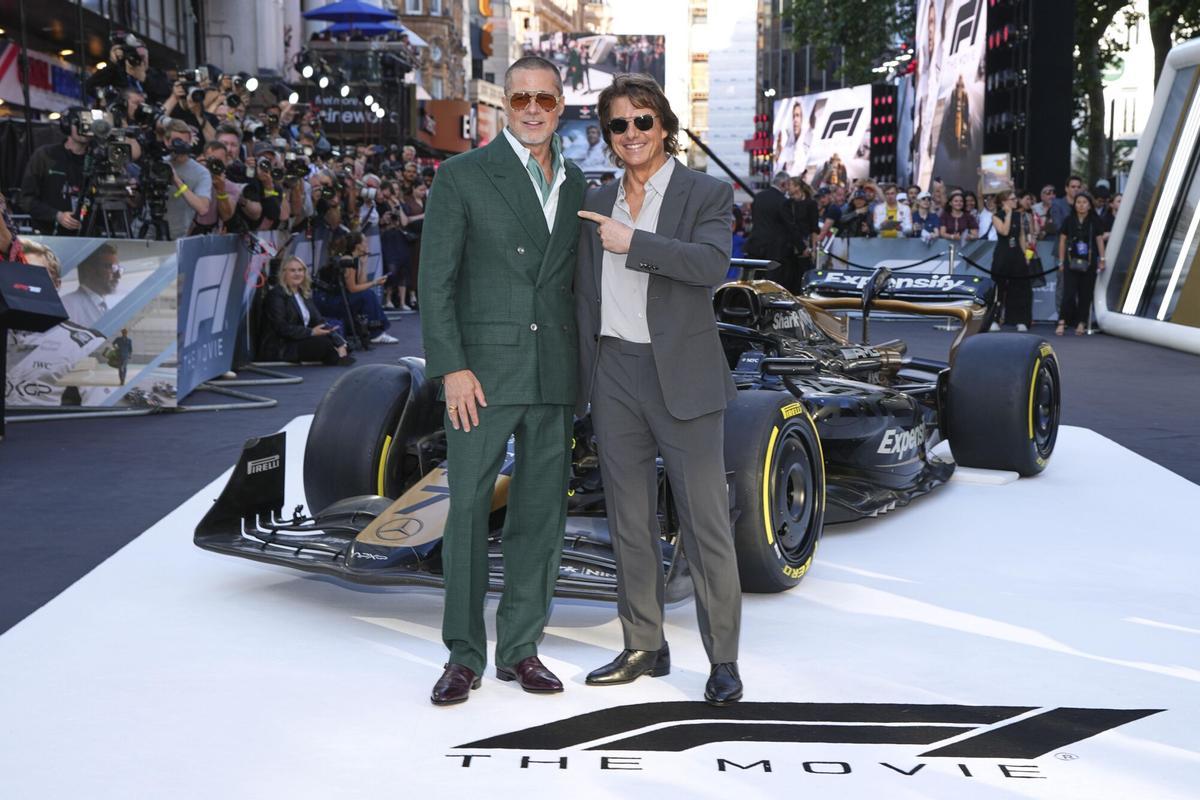Brad Pitt, left, and Tom Cruise pose for photographers upon arrival at the premiere of the film 'F1 The Movie' on Monday, June 23, 2025, in London. (Photo by Scott A Garfitt/Invision/AP). EDITORIAL USE ONLY/ONLY ITALY AND SPAIN