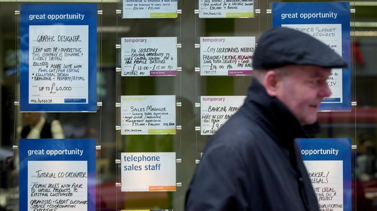 zentauroepp52345097 file photo  a man walks past job advertisements in the windo200219104832