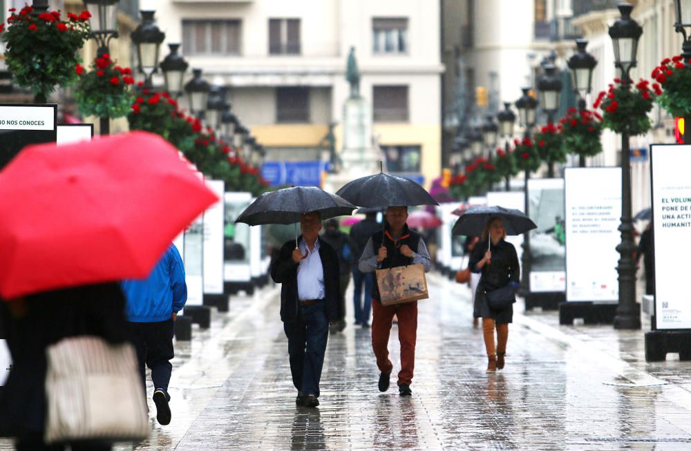 El Centro de Málaga ha vivido un viernes pasado por agua.