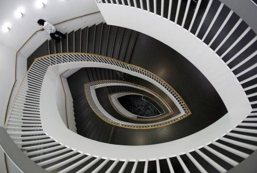 A man walks up a spiral staircase at the Museum of Contemporary Art in Chicago