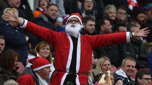 SUNDERLAND  ENGLAND - DECEMBER 18   Bolton Wanderers supporters dressed as Santa Claus watch from the stands during the Barclays Premier League match between Sunderland and Bolton Wanderers at Stadium of Light on December 18  2010 in Sunderland  England   (Photo by Matthew Lewis Getty Images)