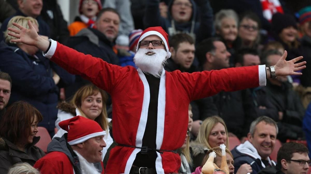 SUNDERLAND  ENGLAND - DECEMBER 18   Bolton Wanderers supporters dressed as Santa Claus watch from the stands during the Barclays Premier League match between Sunderland and Bolton Wanderers at Stadium of Light on December 18  2010 in Sunderland  England   (Photo by Matthew Lewis Getty Images)