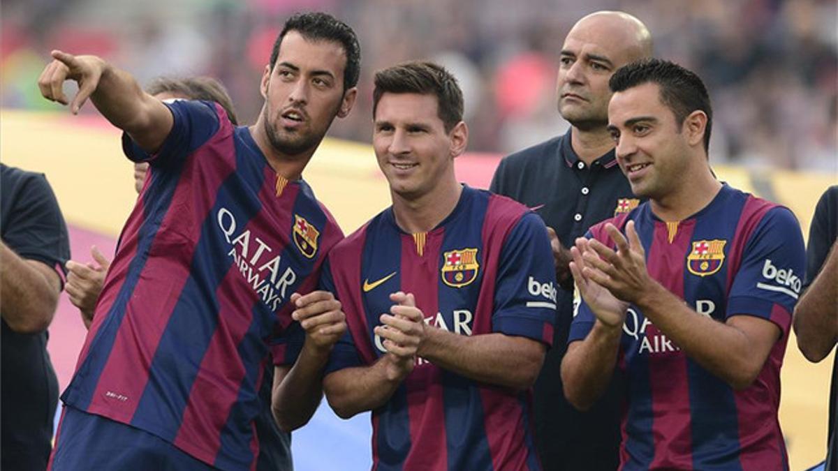 Messi, con Busquets y Xavi