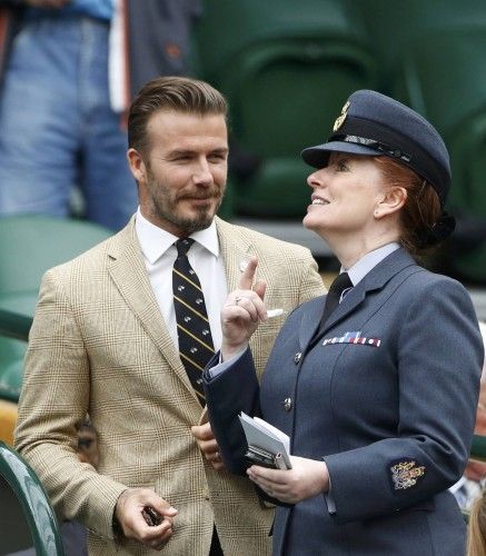 Former England soccer captain David Beckham arrives on Centre Court at the Wimbledon Tennis Championships, in London