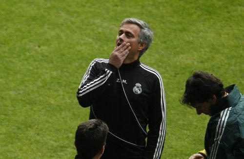 Real Madrid's Mourinho gestures during a training session in Dortmund