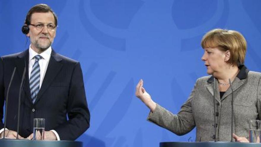 Mariano Rajoy junto a Merkel en Berlín.