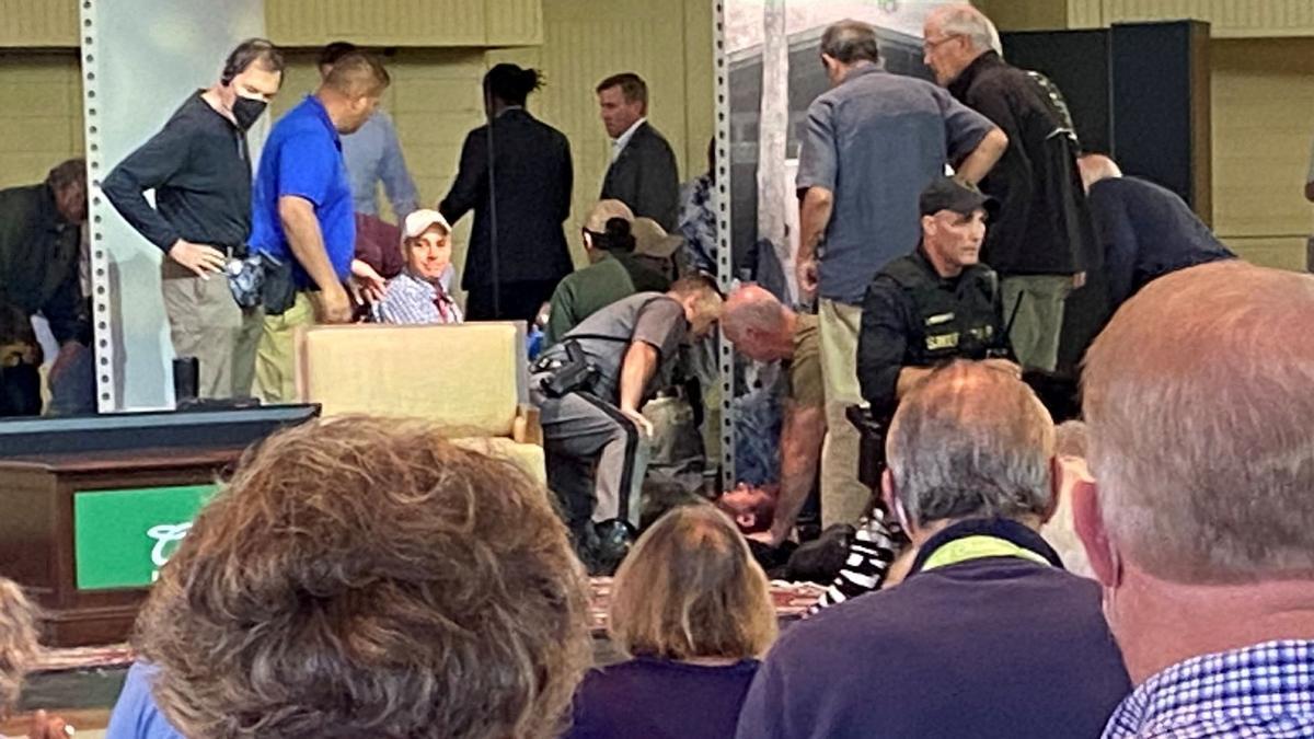 Author Salman Rushdie is treated by emergency personnel after he was stabbed on stage before his scheduled speech at the Chautauqua Institution, Chautauqua, New York, U.S., August 12, 2022, in this picture obtained from social media. TMX/Mary Newsom - freelance journalist from Charlotte, NC/via REUTERS THIS IMAGE HAS BEEN SUPPLIED BY A THIRD PARTY. MANDATORY CREDIT. NO RESALES. NO ARCHIVES. TPX IMAGES OF THE DAY