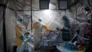 undefined44677713 three medical workers check on an ebola patient in a biosecu180817104858