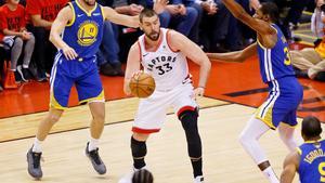 Jun 10, 2019; Toronto, Ontario, CAN; Toronto Raptors center Marc Gasol (33) dribbles the ball while defended by Golden State Warriors guard Klay Thompson (11) and forward Kevin Durant (right) during the first quarter in game five of the 2019 NBA Finals at Scotiabank Arena. Mandatory Credit: John E. Sokolowski-USA TODAY Sports