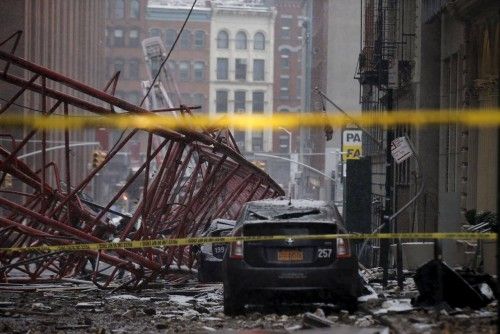 A 565-foot-tall construction crane is seen toppled on the ground in Manhattan, New York