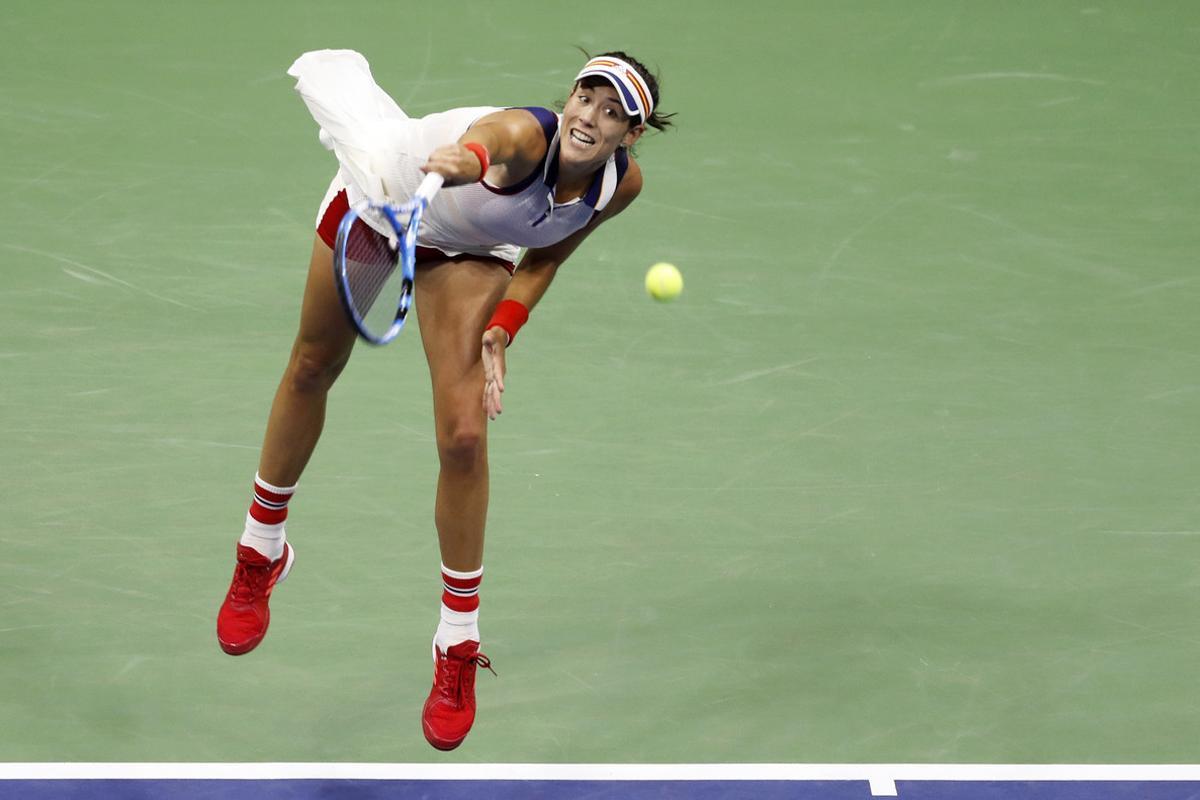 Garbine Muguruza, of Spain, serves against Petra Kvitova, of the Czech Republic, during the fourth round of the U.S. Open tennis tournament, Sunday, Sept. 3, 2017. (AP Photo/Adam Hunger)