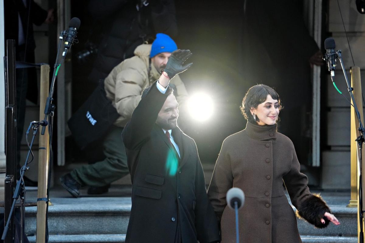 Zohran Mamdani, mayor of New York, left, and his wife Rama Duwaji arrive to an inauguration ceremony at City Hall in New York, US, on Thursday, Jan. 1, 2026. A 34-year-old democratic socialist born in Uganda, Mamdani becomes the city's first mayor of South Asian descent, its first Muslim mayor and the youngest leader of the metropolis of nearly 8.5 million people in more than a century. Photographer: Adam Gray/Bloomberg