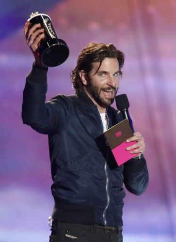 Actor Cooper accepts the award for best kiss for "Silver Linings Playbook" at the 2013 MTV Movie Awards in Culver City