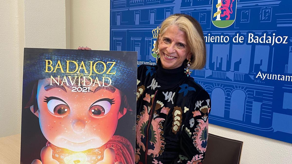 Paloma Morcillo, con el cartel de la Navidad en Badajoz diseñado por Luis Fano.