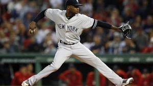FILE - In this Sept. 6, 2019, file photo, New York Yankees’ Domingo German pitches during the first inning of the team’s baseball game against the Boston Red Sox, in Boston.  Yankees pitcher Domingo German will miss the first 63 games of the 2020 season as part of an 81-game ban for violating Major League Baseballâs domestic violence policy. The league announced the suspension Thursday, Jan. 2, 2020. German has agreed not to appeal. (AP Photo/Michael Dwyer, File)