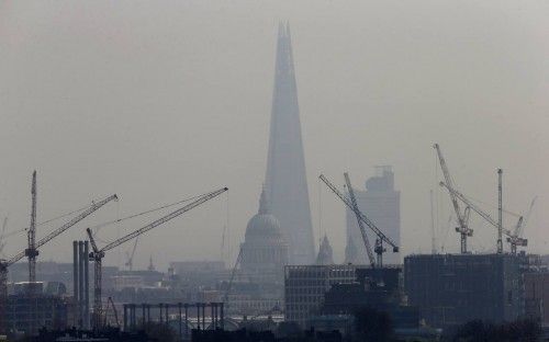 Smog surrounds The Shard, western Europe's tallest building, and St Paul's Cathedral in London