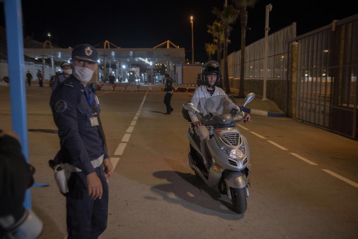 Ceuta (Spain), 17/05/2022.- A motorist is stopped and checked by authorities at a border crossing, as seen from Ceuta, Spanish enclave in northern Africa, 17 May 2022. The border between Ceuta and Melilla and northern Africa were opened at midnight on Tuesday after a 26-month closure. (Marruecos, España) EFE/EPA/Jalal Morchidi