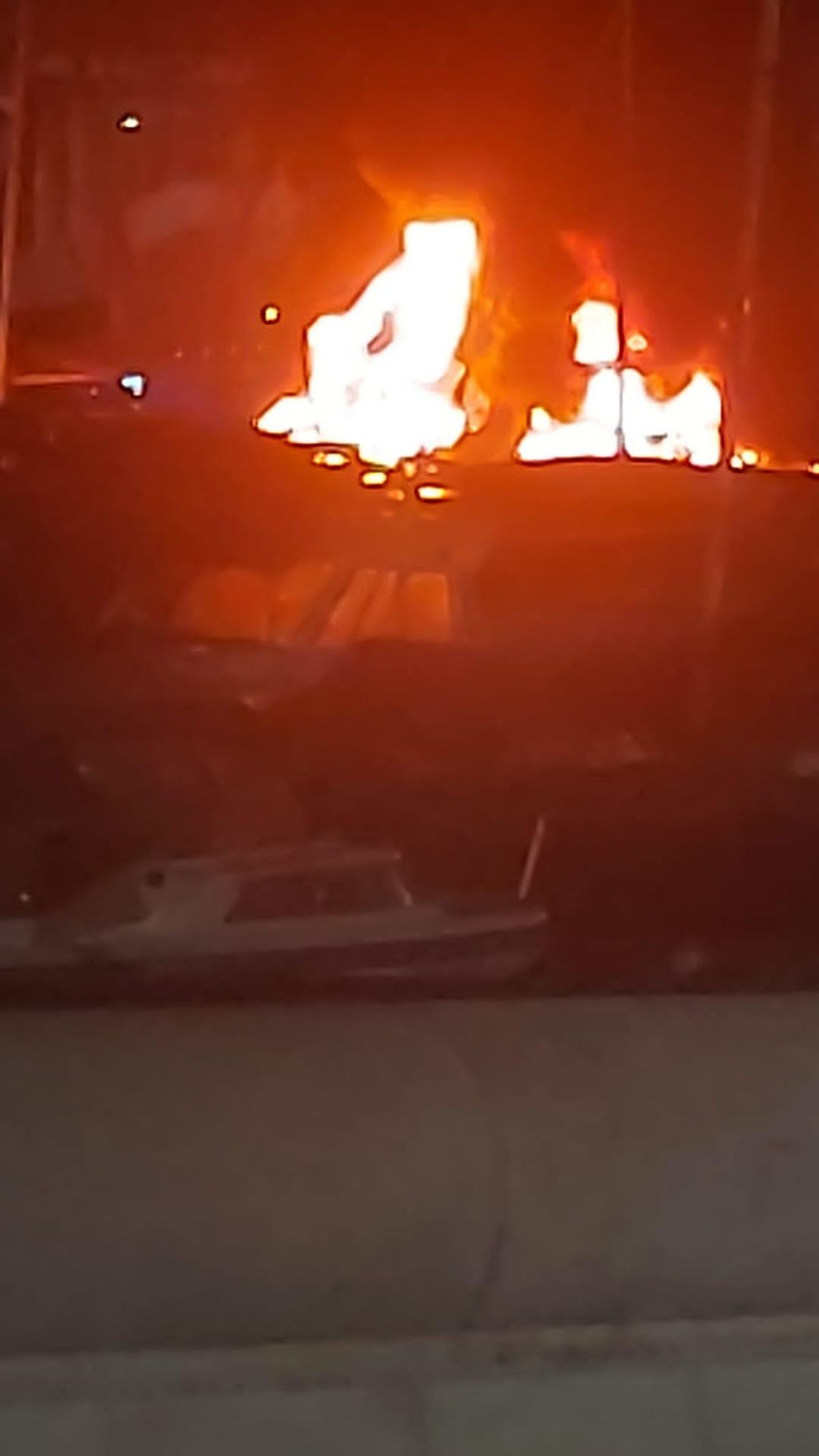 The flames wrap the two vessels