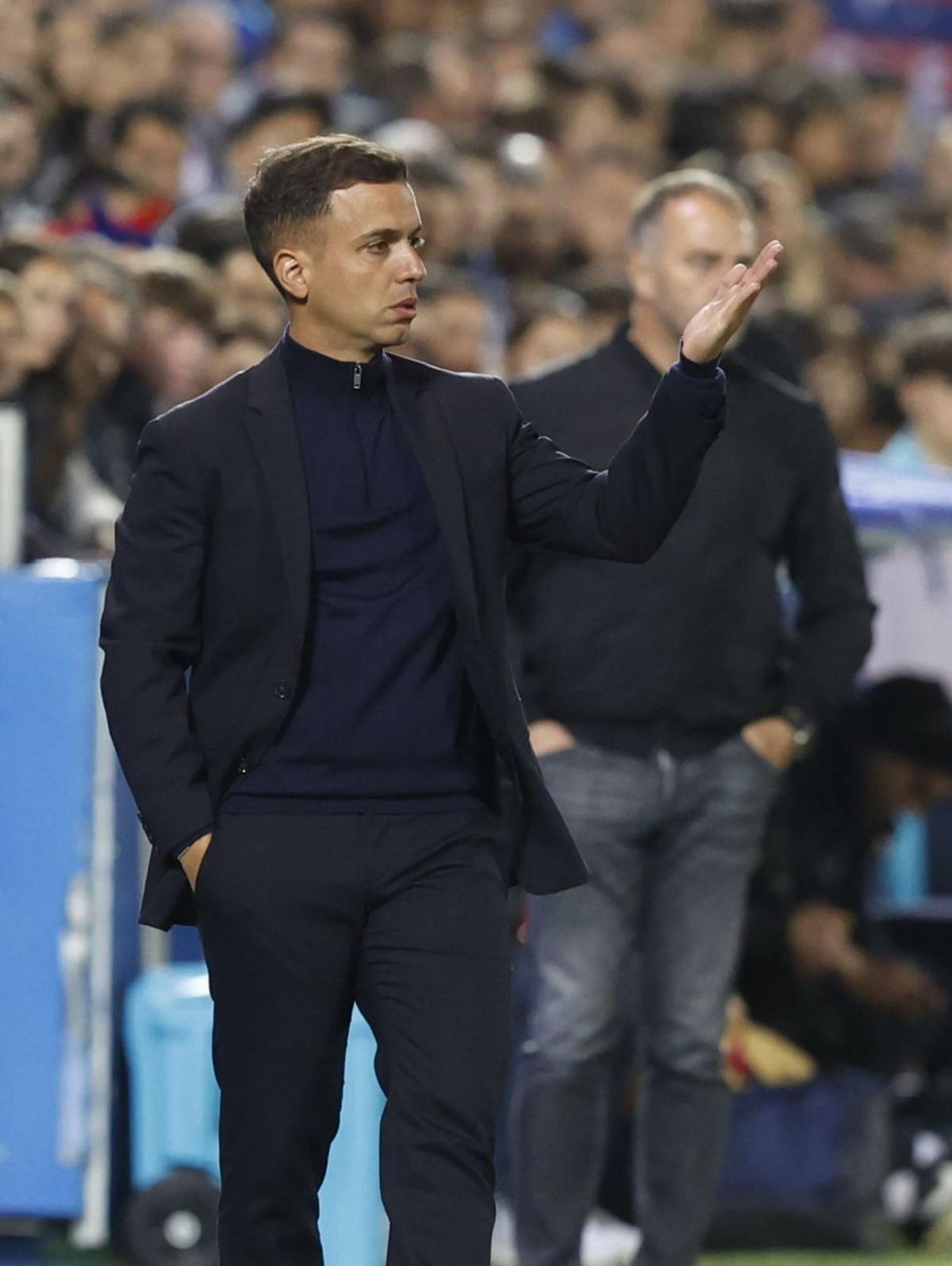 Borja, con Flick al fondo, en Butarque.