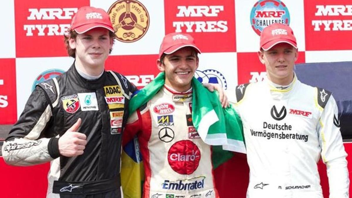 Newey, Fittipaldi y Schumacher, en el podio