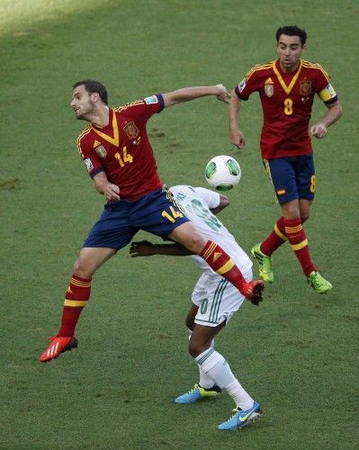 Spain's Soldado fights for the ball with Nigeria's Mikel during their Confederations Cup Group B soccer match at the Estadio Castelao in Fortaleza