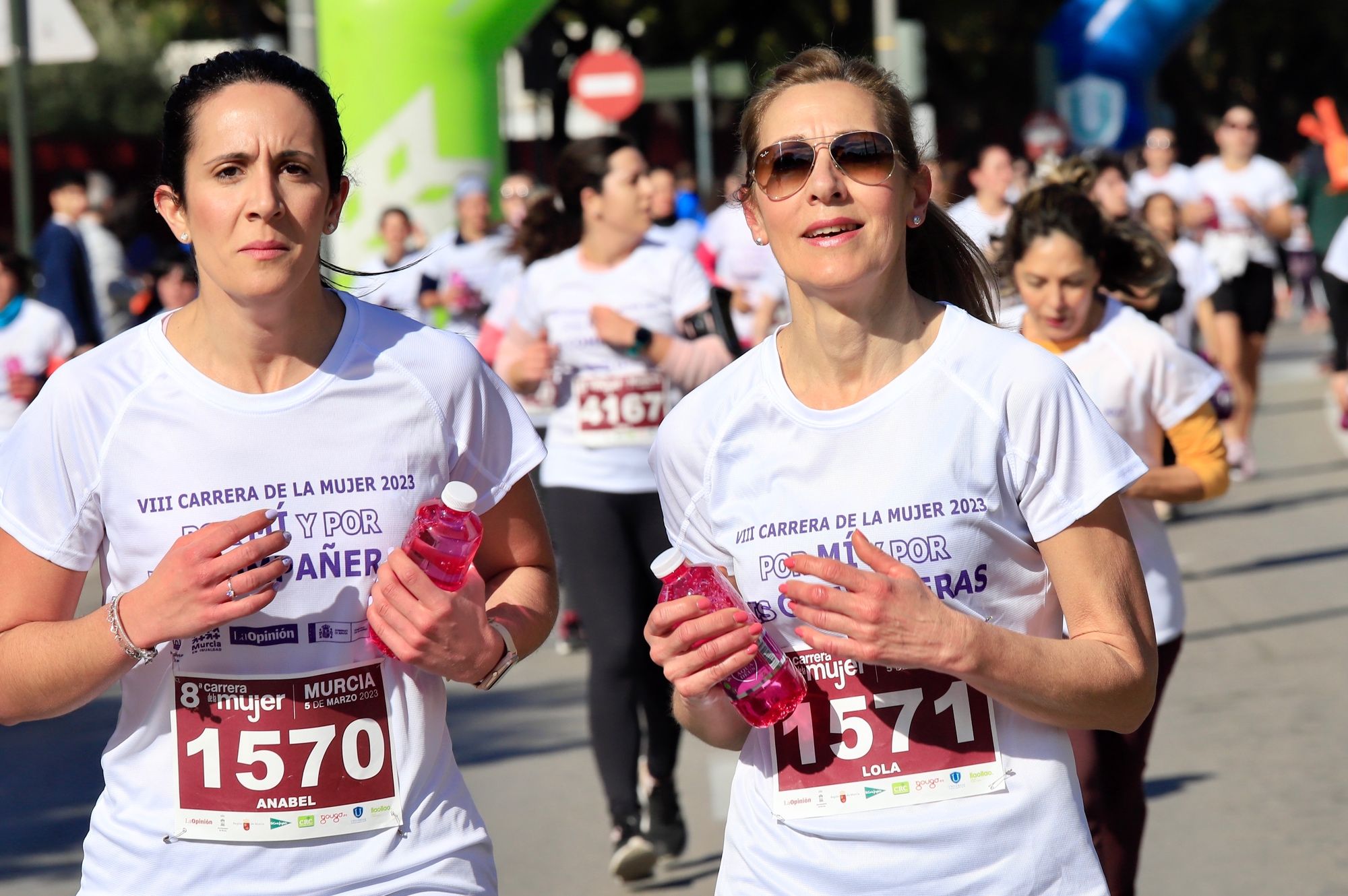 La salida y el recorrido de la Carrera de la Mujer 'inmortalizados' en imágenes