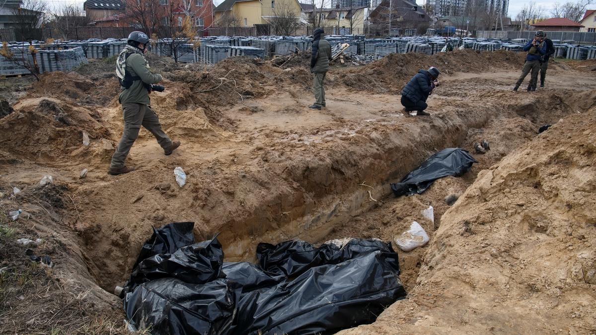 Bodies of civilians, who according to local residents were killed by Russian soldiers, are seen in a mass grave, in Bucha