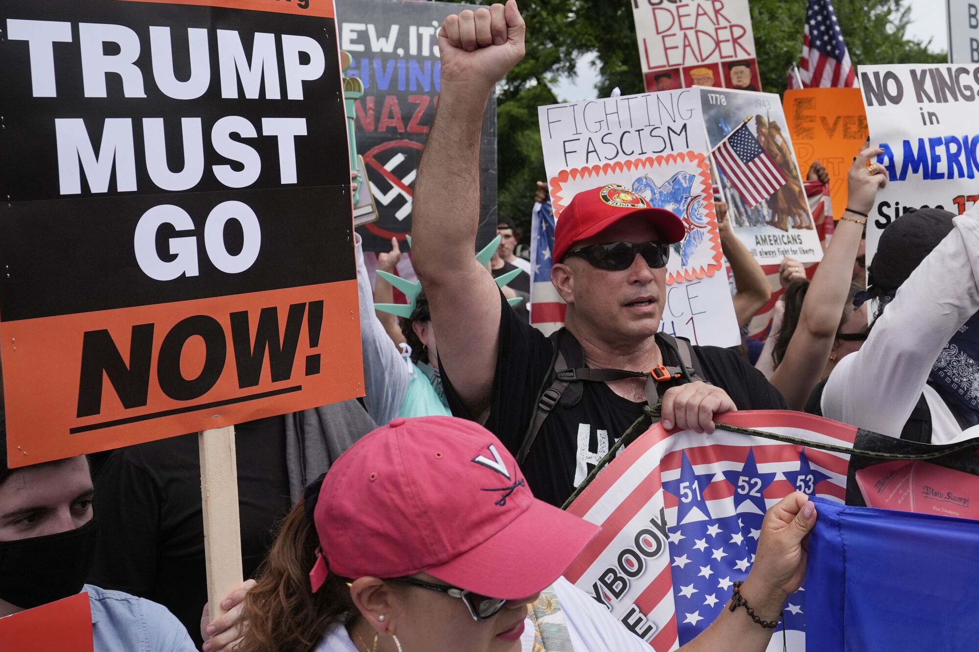 Demonstrators near the White House participate in a protest taking place on the day of a military parade commemorating the Army's 250th anniversary, coinciding with President Donald Trump's 79th birthday, Saturday, June 14, 2025, in Washington. (AP Photo/Alex Brandon)