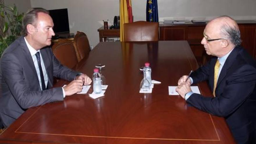 Alberto Fabra y Cristobal Montoro, durante una reunión celebrada en Madrid