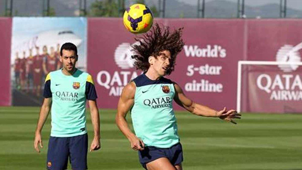 Carles Puyol y Sergio Busquets, en una sesión preparatoria en la Ciutat Esportiva Joan Gamper