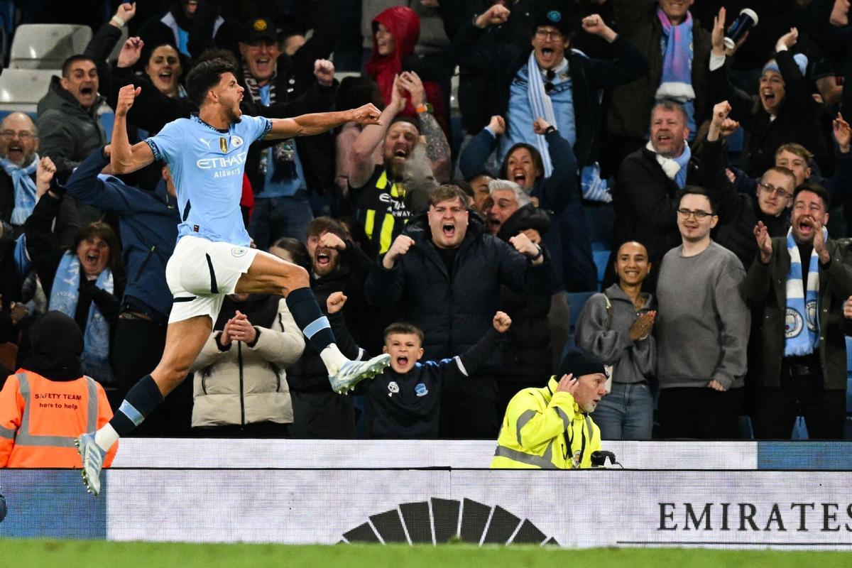 Manchester City's Portuguese midfielder #27 Matheus Nunes celebrates after scoring his team second goal during the English Premier League football match between Manchester City and Aston Villa at the Etihad Stadium in Manchester, north west England, on April 22, 2025. (Photo by Oli SCARFF / AFP) / RESTRICTED TO EDITORIAL USE. No use with unauthorized audio, video, data, fixture lists, club/league logos or 'live' services. Online in-match use limited to 120 images. An additional 40 images may be used in extra time. No video emulation. Social media in-match use limited to 120 images. An additional 40 images may be used in extra time. No use in betting publications, games or single club/league/player publications. /. SEE CAPTION FOR MORE INFORMATION / RESTRICTED TO EDITORIAL USE. No use with unauthorized audio, video, data, fixture lists, club/league logos or 'live' services. Online in-match use limited to 120 images. An additional 40 images may be used in extra time