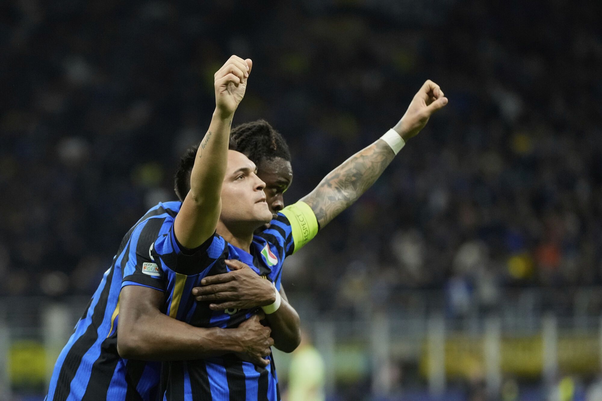 Inter Milan's Lautaro Martinez celebrates after scoring his side's opening goal during the Champions League semifinal second leg soccer match between Inter Milan and Barcelona at San Siro stadium in Milan , Italy, Tuesday, May 6, 2025. (AP Photo/Luca Bruno). EDITORIAL USE ONLY / ONLY ITALY AND SPAIN