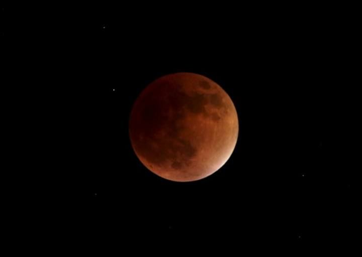 A supermoon is seen in the sky in Port-of-Spain