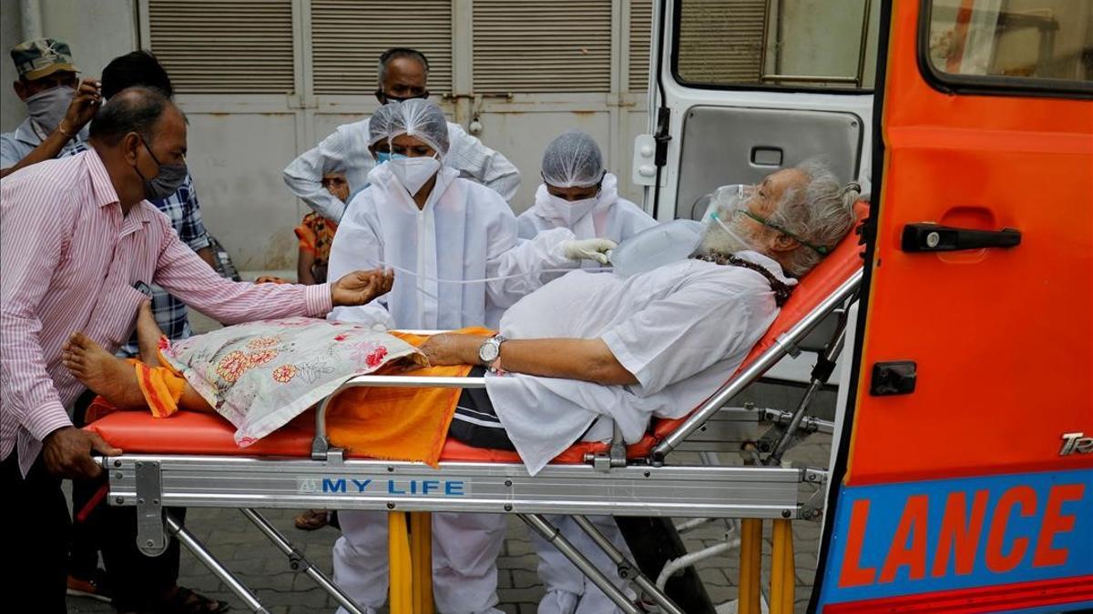 A patient wearing an oxygen mask is wheeled inside a COVID-19 hospital for treatment  amidst the spread of the coronavirus disease (COVID-19) in Ahmedabad  India  April 26  2021  REUTERS Amit Dave