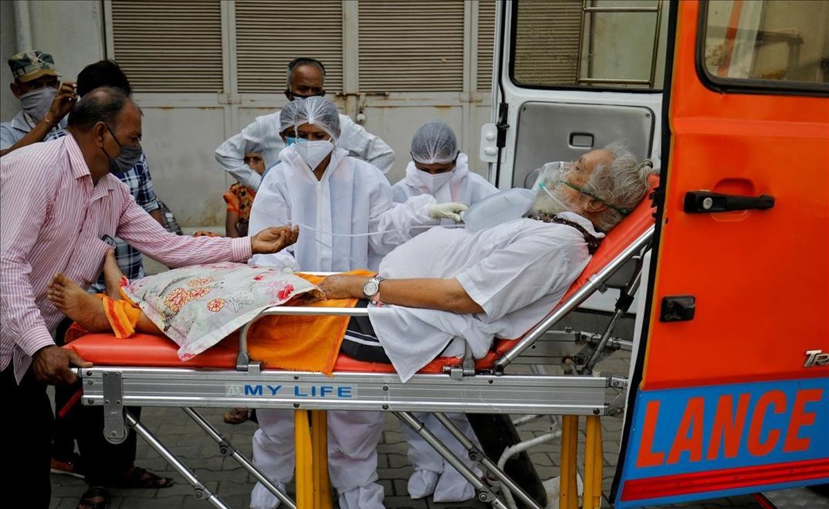 A patient wearing an oxygen mask is wheeled inside a COVID-19 hospital for treatment amidst the spread of the coronavirus disease (COVID-19) in Ahmedabad India April 26 2021 REUTERS Amit Dave