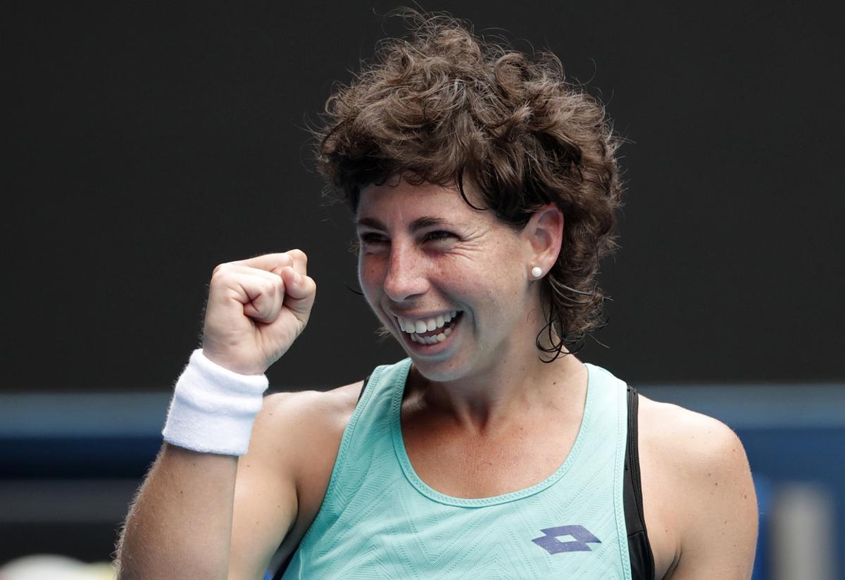 Spain’s Carla Suarez Navarro celebrates after defeating Anett Kontaveit of Estonia in their fourth round match at the Australian Open tennis championships in Melbourne, Australia Sunday, Jan. 21, 2018. (AP Photo/Vincent Thian)