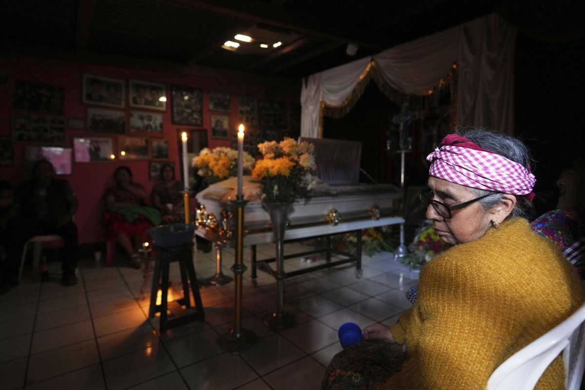 A nieighbor attends the wake for Carlos Alberto Cuy, who died following dozens of earthquakes and aftershocks that were recorded in a matter of hours, in Santa Maria de Jesus, Guatemala, Wednesday, July 9, 2025. (AP Photo/Moises Castillo). EDITORIAL USE ONLY/ONLY ITALY AND SPAIN